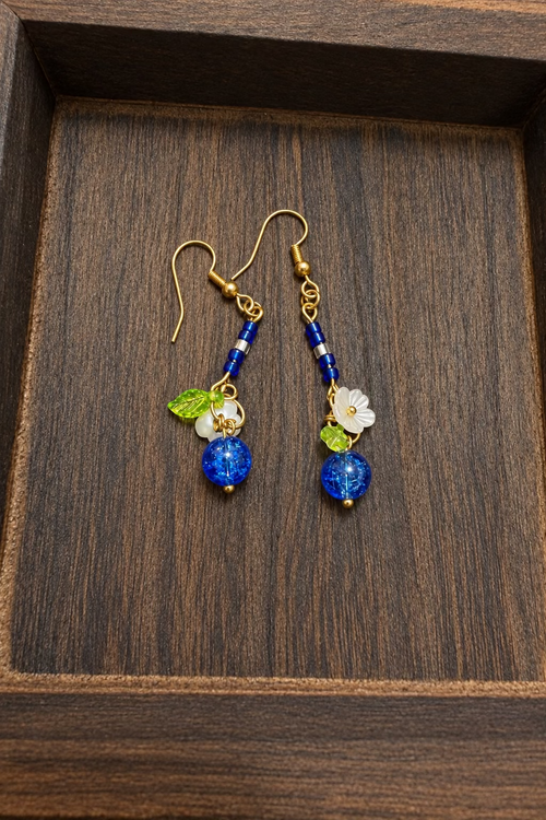 Blueberry Bloom handmade glass bead dangle earrings with blue crackle glass, white flowers and green leaves