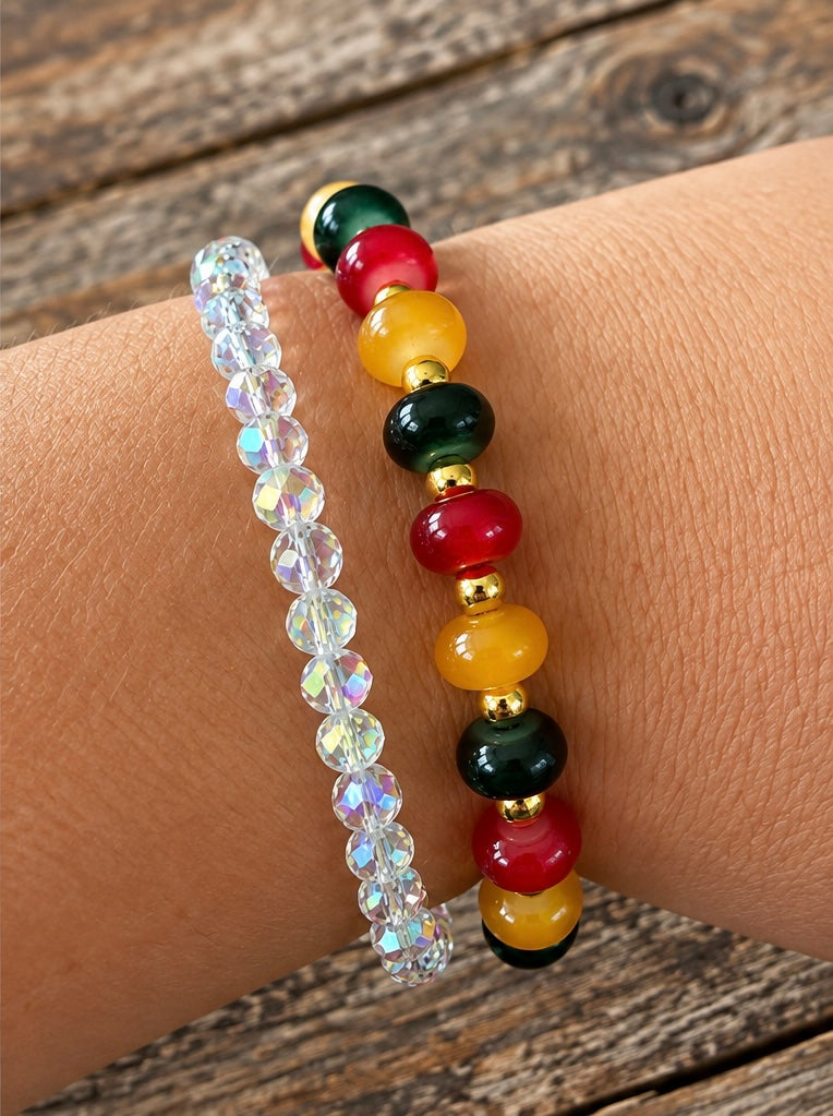 A glass bead stretch bracelet with gold spacers.  It is a deep red, dark green, and gold glass with the gold spacers.