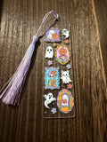 Handmade Halloween acrylic bookmark with a ghostly picture design.  Includes an adorable cat ghost on the design and a coordinating lavender tassel.