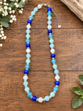 handmade blue and white glass beaded necklace with faceted aurora glass spacers